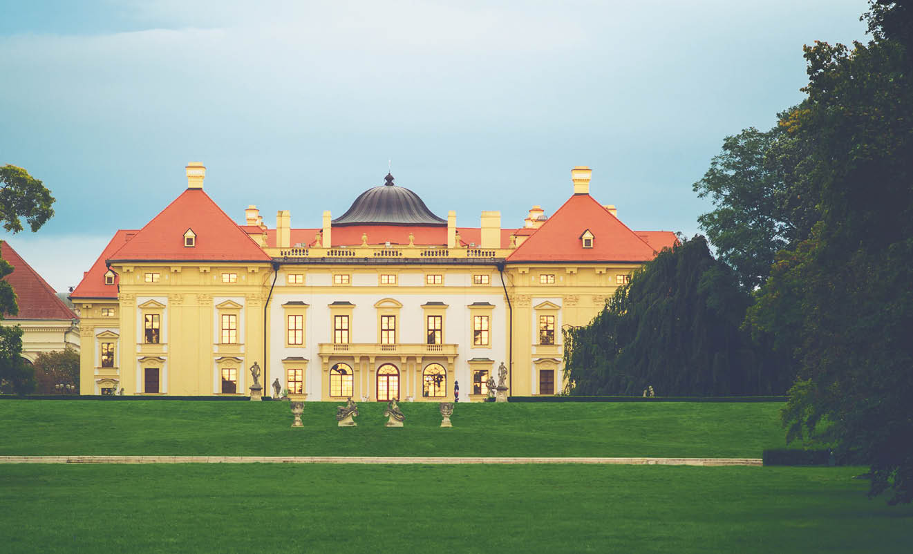 Austerlitz Castle - a stunning baroque palace at twilight with gold sunset reflecting from the windows   Slavkov u Brna, South Moravia, Czech Republic 
