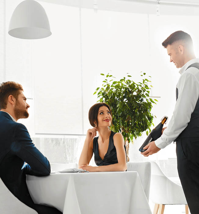 Romantic Dinner  Sommelier Presenting Best Wine To Happy Couple In Love  People Having Date In Gourmet Restaurant  Celebrating Anniversary Or Valentine's Day  Romance, Relationship  Alcoholic Drinks 