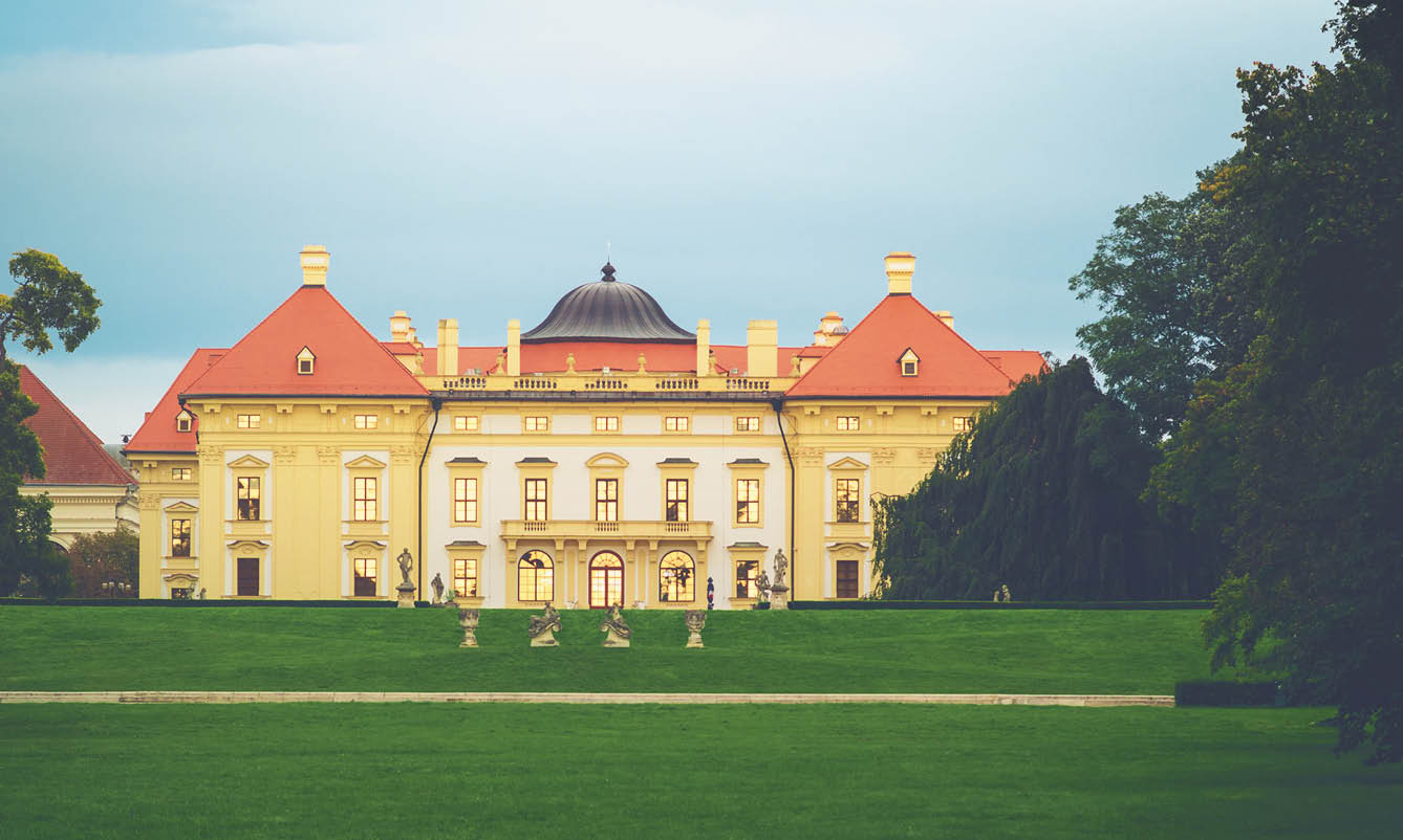 Austerlitz Castle - a stunning baroque palace at twilight with gold sunset reflecting from the windows   Slavkov u Brna, South Moravia, Czech Republic 
